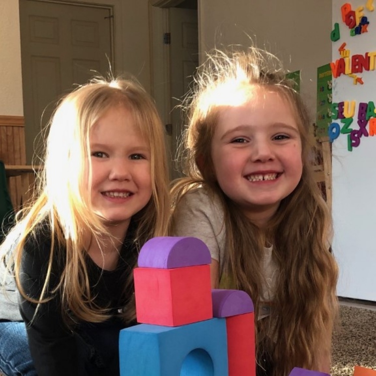 little girls play blocks