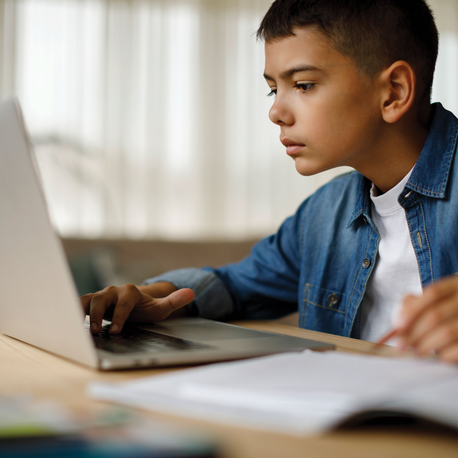 A student works on a notebook computer
